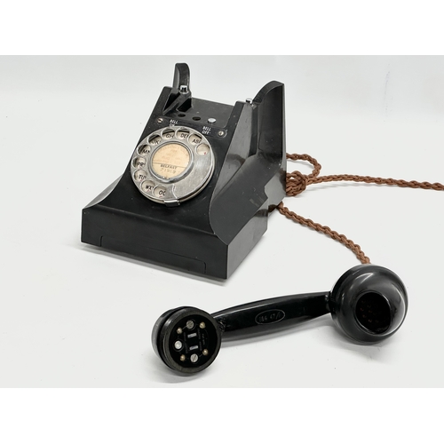 403 - A vintage Bakelite telephone.