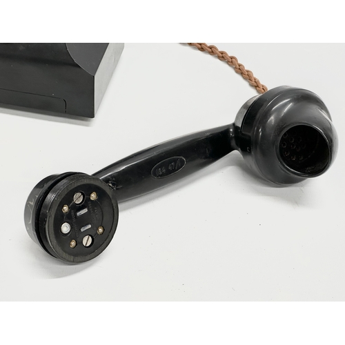 403 - A vintage Bakelite telephone.