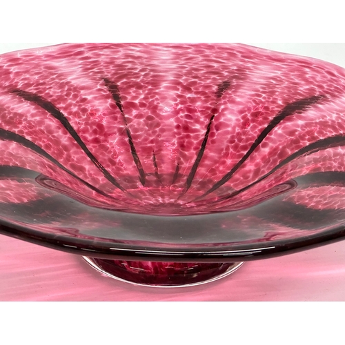 457 - A footed cranberry glass dish by Teign Valley Glass. 20x5.5cm