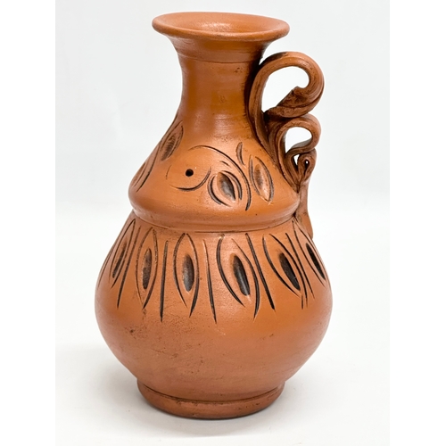 548 - A terracotta pot and vase. 32cm