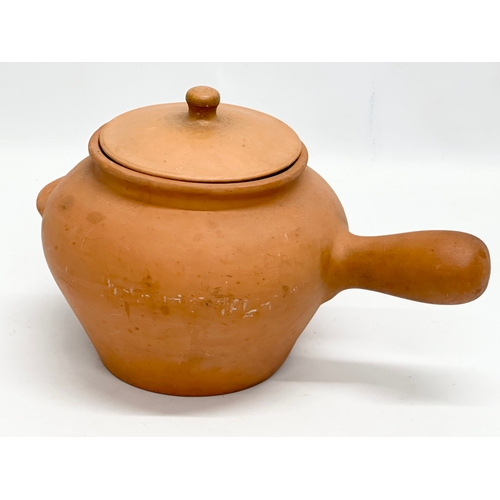 548 - A terracotta pot and vase. 32cm