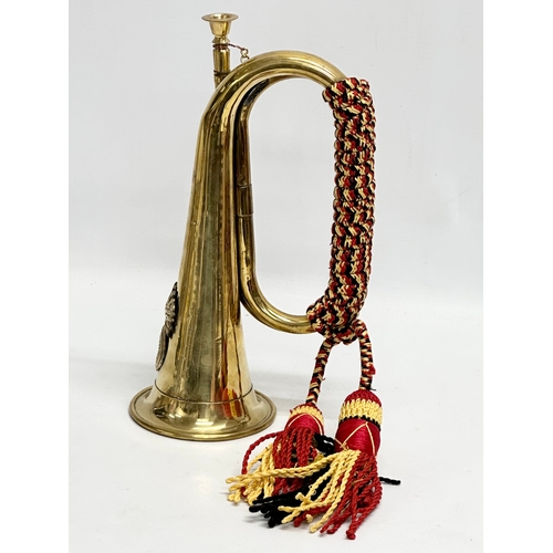 555 - A brass bugle. 28cm