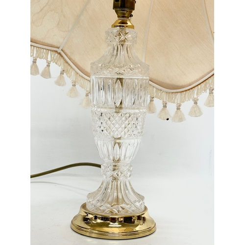 557 - A vintage cut glass table lamp. 56cm