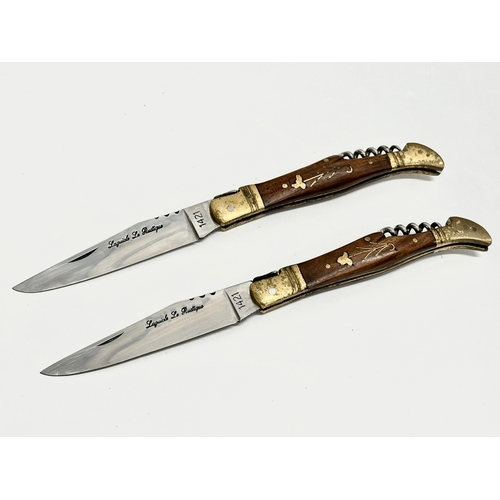 436 - A pair of Laguiole pocket knives with corkscrews. 22cm open.