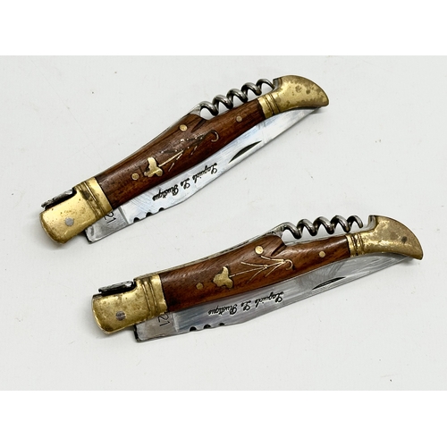 436 - A pair of Laguiole pocket knives with corkscrews. 22cm open.