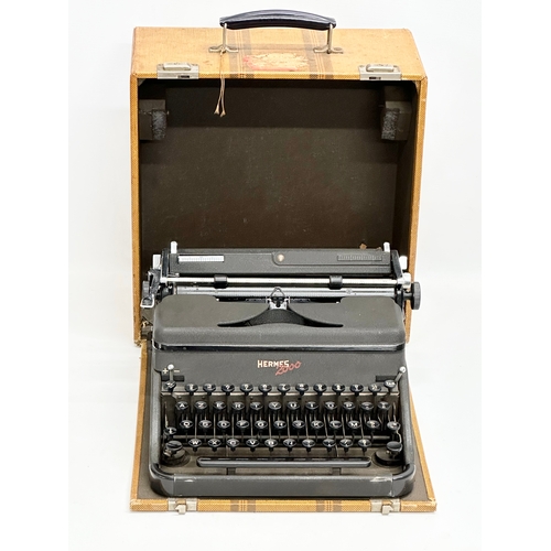 434 - A 1949 Hermes 2000 typewriter with case.