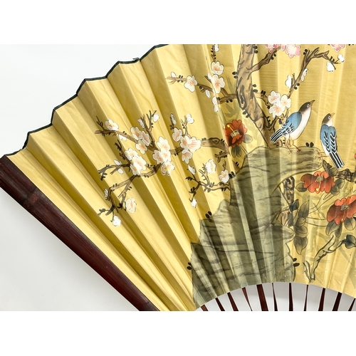 287 - A large Early 20th Century Chinese hand painted fan. 150x89cm