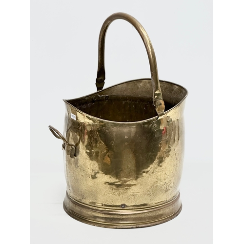 301 - An Early 20th Century brass coal scuttle. 28x32x29cm