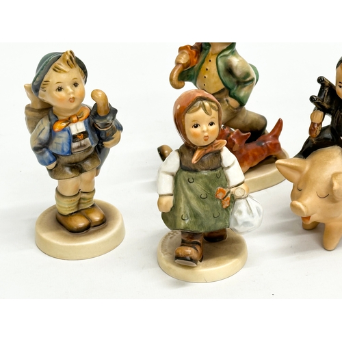 561 - 5 M.J. Hummel Goebel pottery figurines.