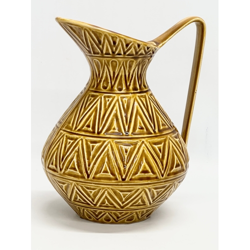 571 - A large Irish glazed pottery jug by Celtic Ceramics. 23x20x28cm