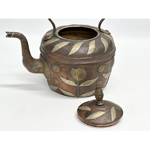 290 - A Late 19th Century Indian copper kettle with brass foliage. 25x17x23cm