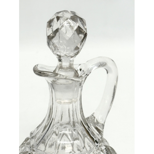 309 - A Late 19th Century pressed glass vinegar cruet bottle. 17cm