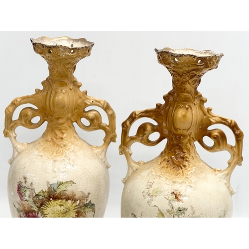 331 - A pair of large hand painted pottery vases. Circa 1890-1910. 35cm