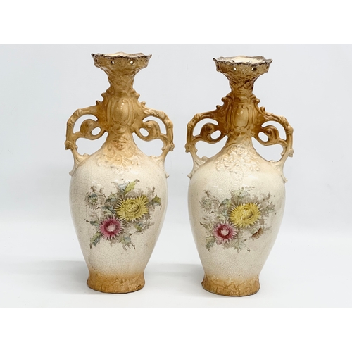 331 - A pair of large hand painted pottery vases. Circa 1890-1910. 35cm