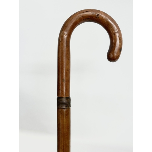 279 - An Early 20th Century walking stick umbrella. D.R.G.M. 85.5cm