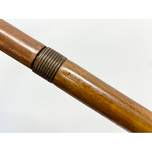 279 - An Early 20th Century walking stick umbrella. D.R.G.M. 85.5cm