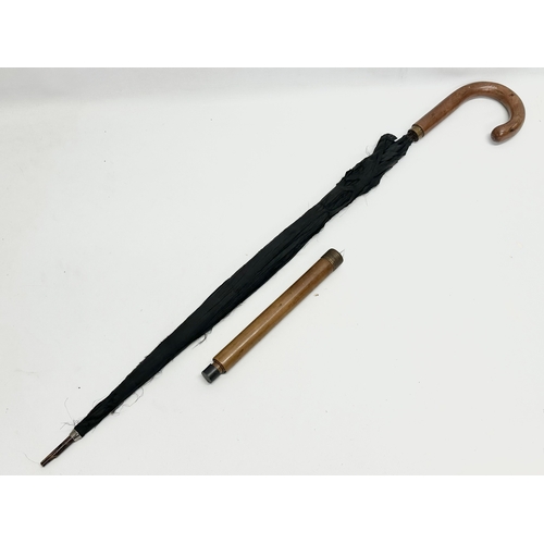 279 - An Early 20th Century walking stick umbrella. D.R.G.M. 85.5cm