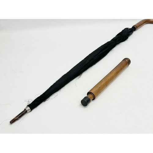 279 - An Early 20th Century walking stick umbrella. D.R.G.M. 85.5cm