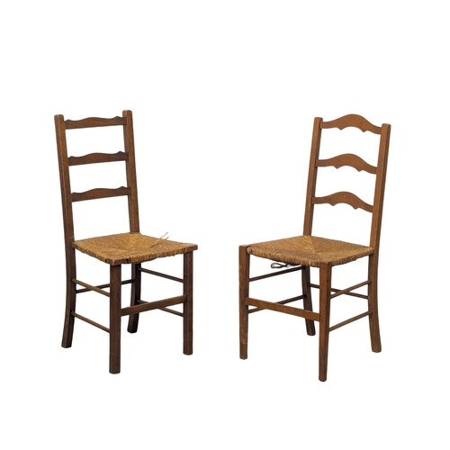 836 - A set of 4 Early 20th century kitchen chairs with rush seats.