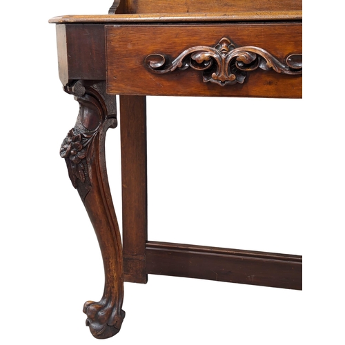 842 - A Victorian mahogany hall stand on Ball & Claw feet. 90x48x204cm