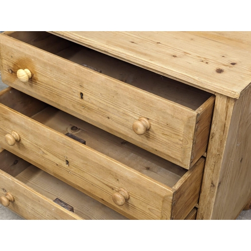 845 - A Victorian pine chest of drawers on bun feet. 77x43x68cm