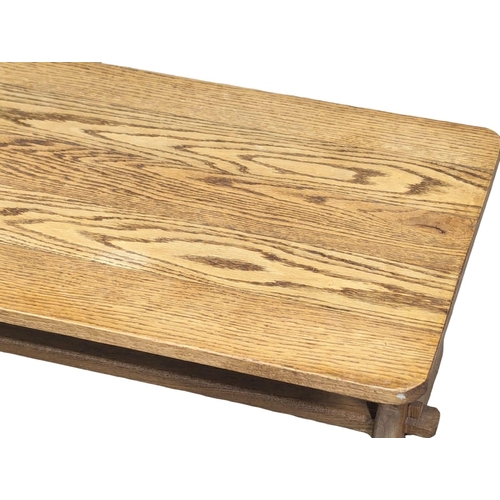 858 - A vintage oak coffee table. 92x51x38cm