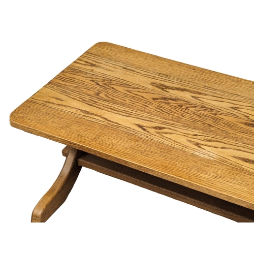 858 - A vintage oak coffee table. 92x51x38cm