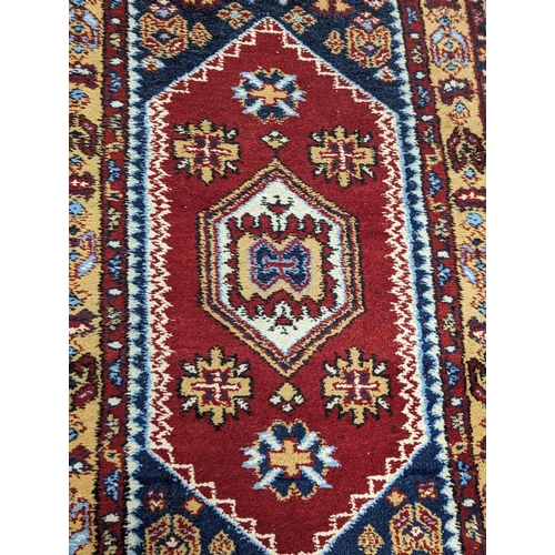 866 - A vintage Middle Eastern hand knotted rug. 96x196cm