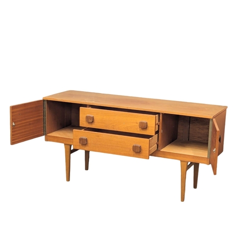 870 - A Mid Century teak sideboard designed by Frank Guille for Austinsuite. 133x43x66cm