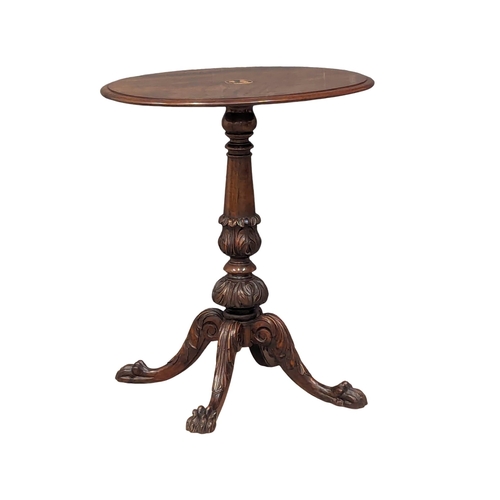 878 - A good quality Victorian inlaid mahogany pedestal table on lion paw feet. 66x77cm