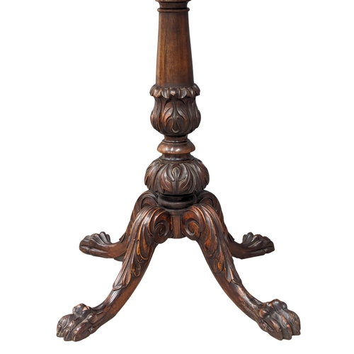 878 - A good quality Victorian inlaid mahogany pedestal table on lion paw feet. 66x77cm