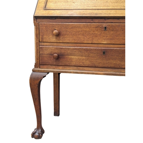 887 - An Early 20th Century on mahogany Chippendale style bureau bookcase on Cabriole legs and Ball & Claw... 