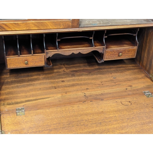 887 - An Early 20th Century on mahogany Chippendale style bureau bookcase on Cabriole legs and Ball & Claw... 