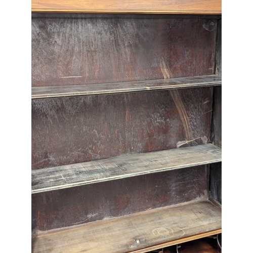 887 - An Early 20th Century on mahogany Chippendale style bureau bookcase on Cabriole legs and Ball & Claw... 