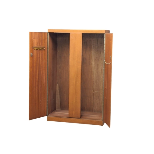 911 - A Mid Century teak wardrobe designed by Frank Guille for Austinsuite. 107x52.5x174.5cm.