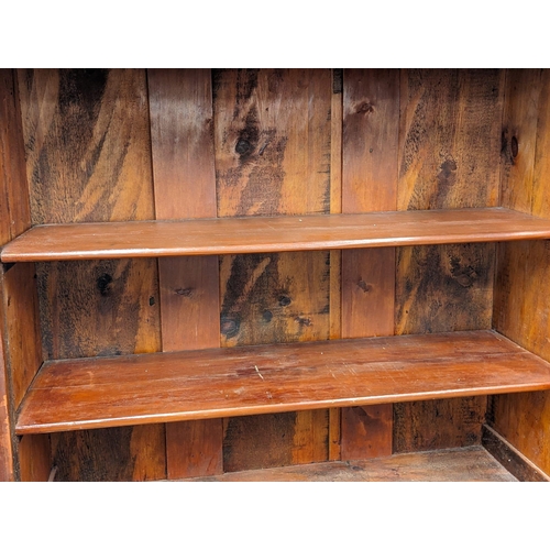 915 - A Late Victorian birch 2 piece bookcase with carved corbel decoration. Circa 1870s/1880s. 123x54x204... 