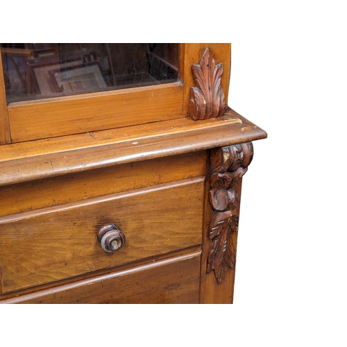 915 - A Late Victorian birch 2 piece bookcase with carved corbel decoration. Circa 1870s/1880s. 123x54x204... 