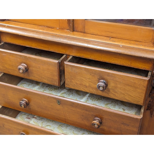 915 - A Late Victorian birch 2 piece bookcase with carved corbel decoration. Circa 1870s/1880s. 123x54x204... 