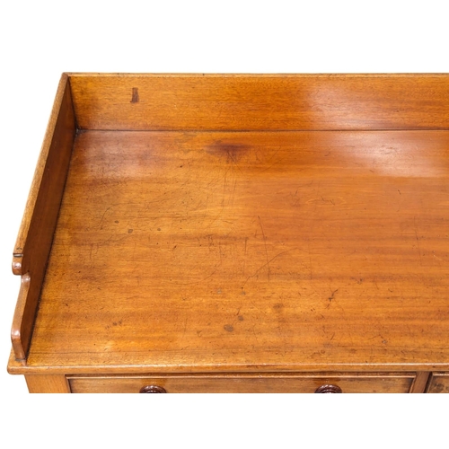 979 - An Early Victorian mahogany gallery back side table with 2 drawers. 110x53.5x87.5cm