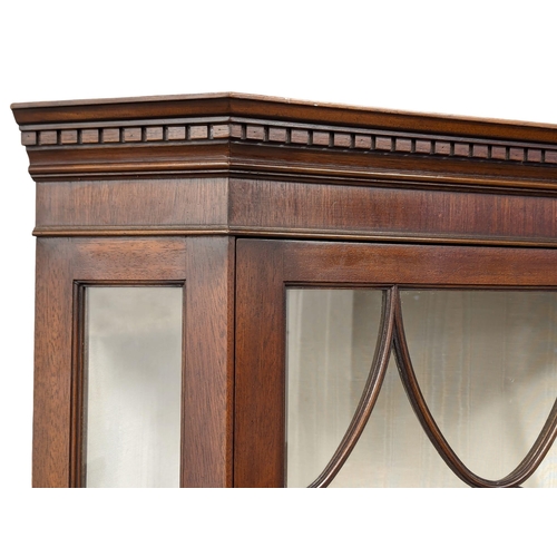 981 - A Georgian style mahogany corner display cabinet.74x50x187cm