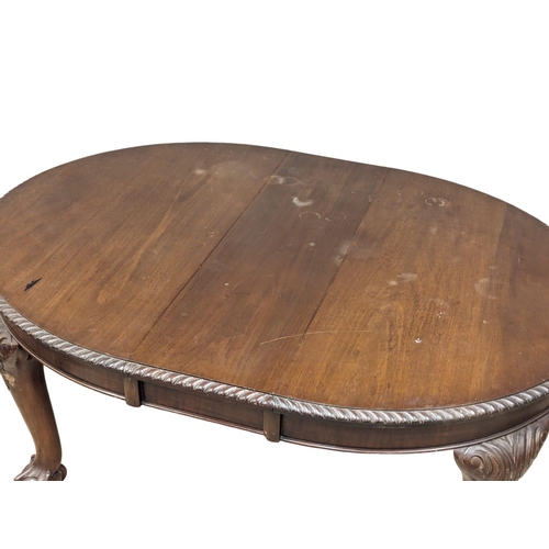 983 - An Early 20th Century Chippendale Revival mahogany dining table. 150x107x76cm