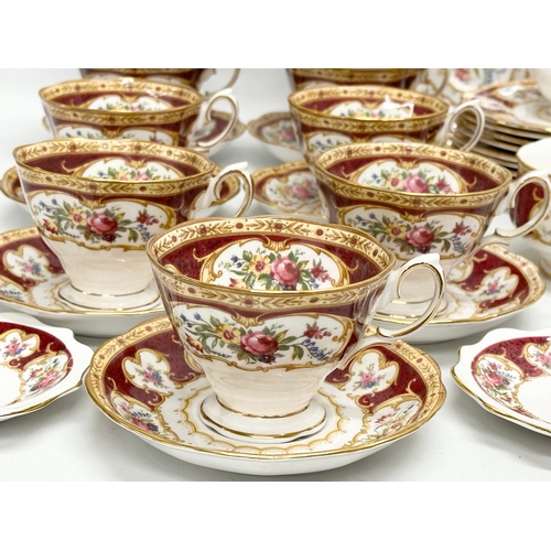 295 - A 33 piece Royal Albert ‘Lady Hamilton’ tea service. 9 cups, 10 saucers, 10 sandwich plates, milk ju... 