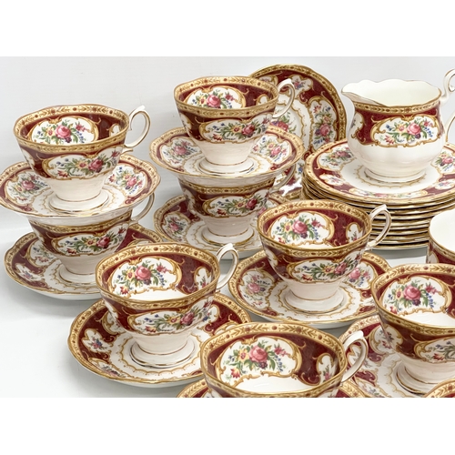 295 - A 33 piece Royal Albert ‘Lady Hamilton’ tea service. 9 cups, 10 saucers, 10 sandwich plates, milk ju... 