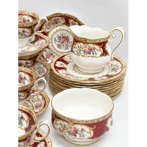 295 - A 33 piece Royal Albert ‘Lady Hamilton’ tea service. 9 cups, 10 saucers, 10 sandwich plates, milk ju... 