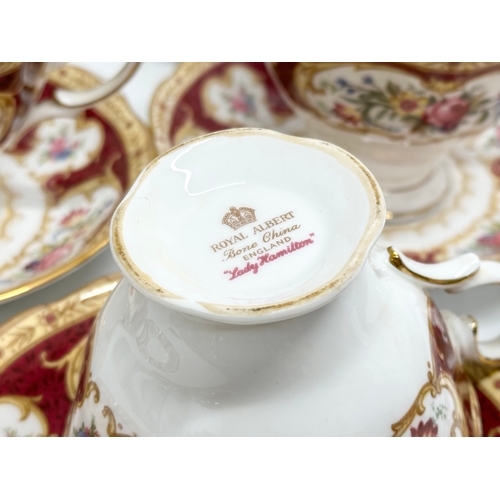 295 - A 33 piece Royal Albert ‘Lady Hamilton’ tea service. 9 cups, 10 saucers, 10 sandwich plates, milk ju... 