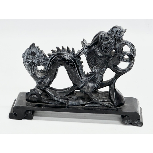 585 - A Chinese soapstone dragon. 19x14cm