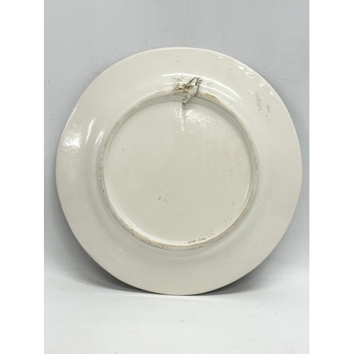 590 - A set of 4 Late 19th/Early 20th Century French earthenware plates. Probably Quimper. 22cm