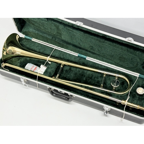 549 - An Elkhart Deluxe trombone with case.