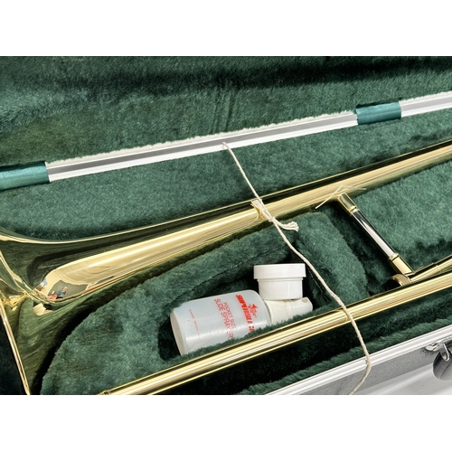 549 - An Elkhart Deluxe trombone with case.