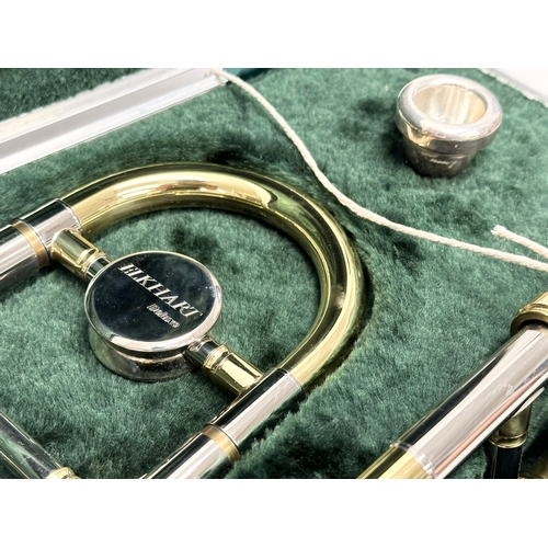 549 - An Elkhart Deluxe trombone with case.